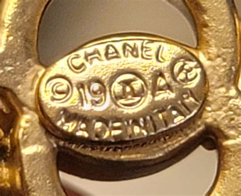 chanel brooch fake vs real|authentic chanel jewelry stamp.